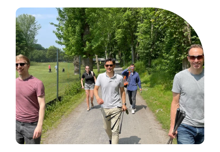 Image of the Beatgrid company team meeting walking in a golf court - 2